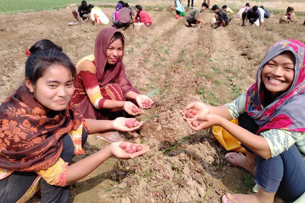 9. Girls are happy to collect potatoes from garden 1 edited