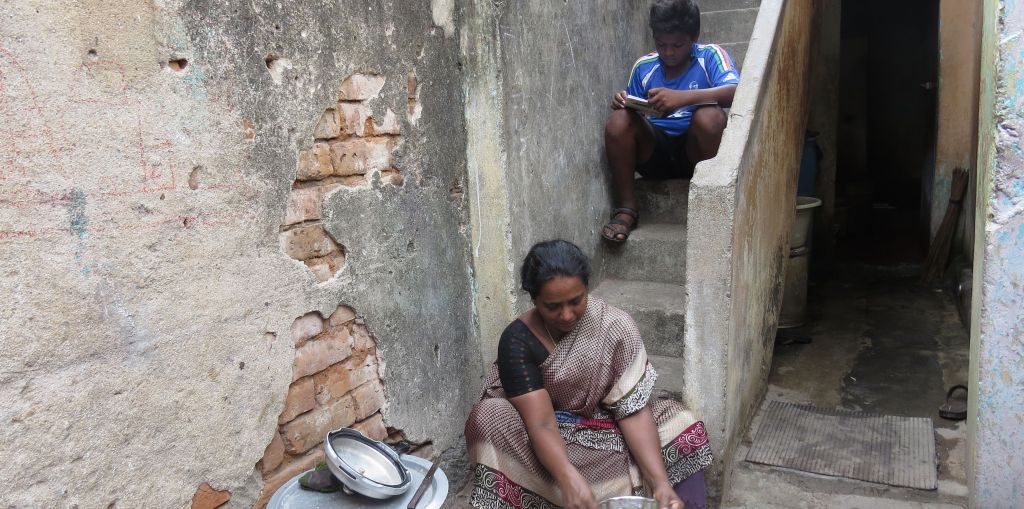 Boy studying at home in Chennai slum