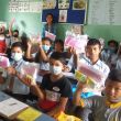 Adventist school children with learning resource packages