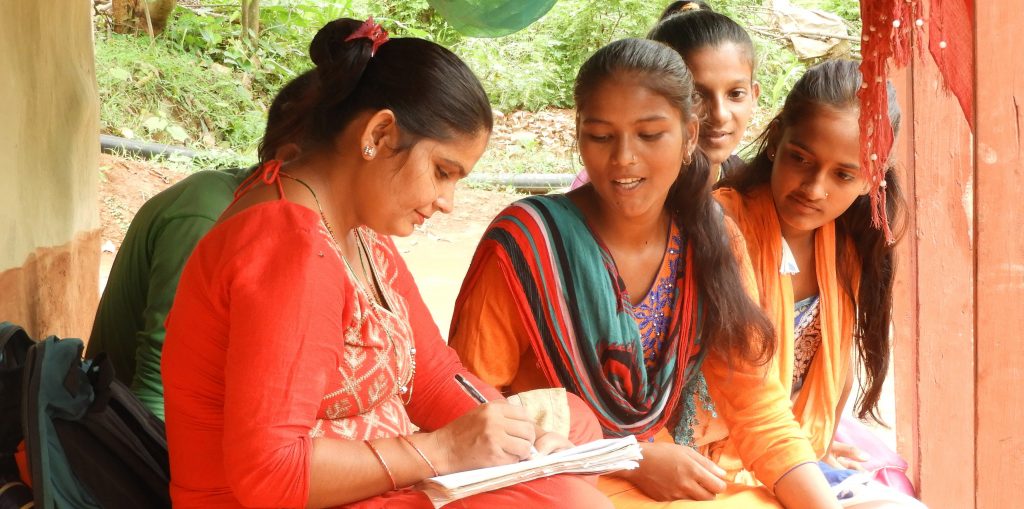 Staff with a change agent in Nepal